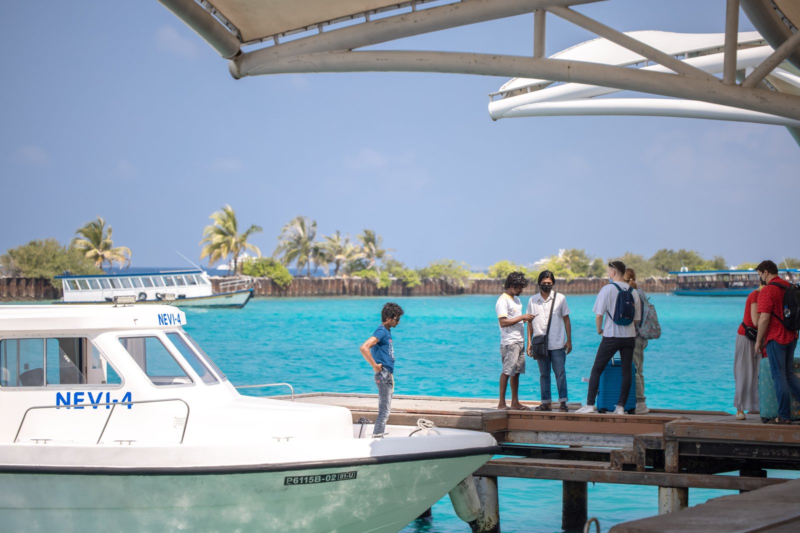 Travellers arriving by speedboat in the Maldives